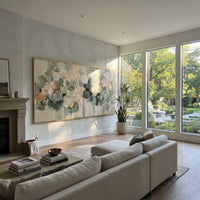 "Sage Green Round Leaf Painting" focuses on atmosphere, surface movement, and sculptural heavy impasto craftsmanship rather than a fixed literal storyline. The composition uses this hand-painted panoramic canvas presents a horizontal round-leaf branch cluster in sage green, cream, dark green, and soft gold over a neutral ground, with visible raised palette-knife texture and handmade surface depth as the visual anchor, while layered palette-knife paint, raised plaster-like texture, and softened
