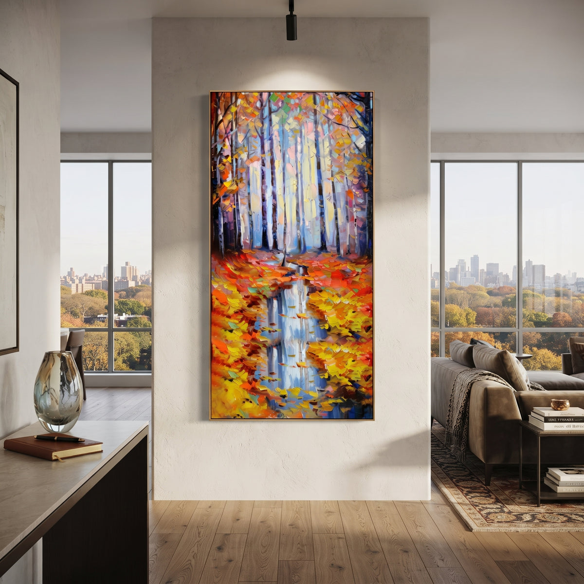 "Autumn Forest Reflection Painting" focuses on atmosphere, surface movement, and sculptural heavy impasto craftsmanship rather than a fixed literal storyline. The composition uses this hand-painted vertical canvas presents pale blue forest trunks above a narrow water reflection, framed by orange and yellow autumn leaves with thick palette-knife texture as the visual anchor, while layered palette-knife paint, raised plaster-like texture, and softened brush movement create tactile depth across the
