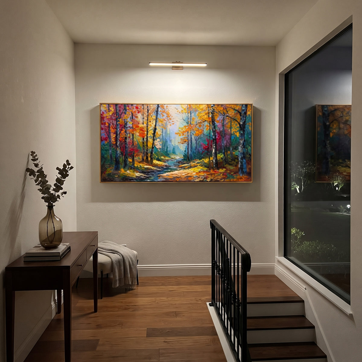 "Blue Gold Forest Path Painting" focuses on atmosphere, surface movement, and sculptural heavy impasto craftsmanship rather than a fixed literal storyline. The composition uses this hand-painted panoramic canvas presents a glowing yellow forest path surrounded by deep blue trunks, teal shadows, red orange leaves, and vivid raised paint texture as the visual anchor, while layered palette-knife paint, raised plaster-like texture, and softened brush movement create tactile depth across the canvas.