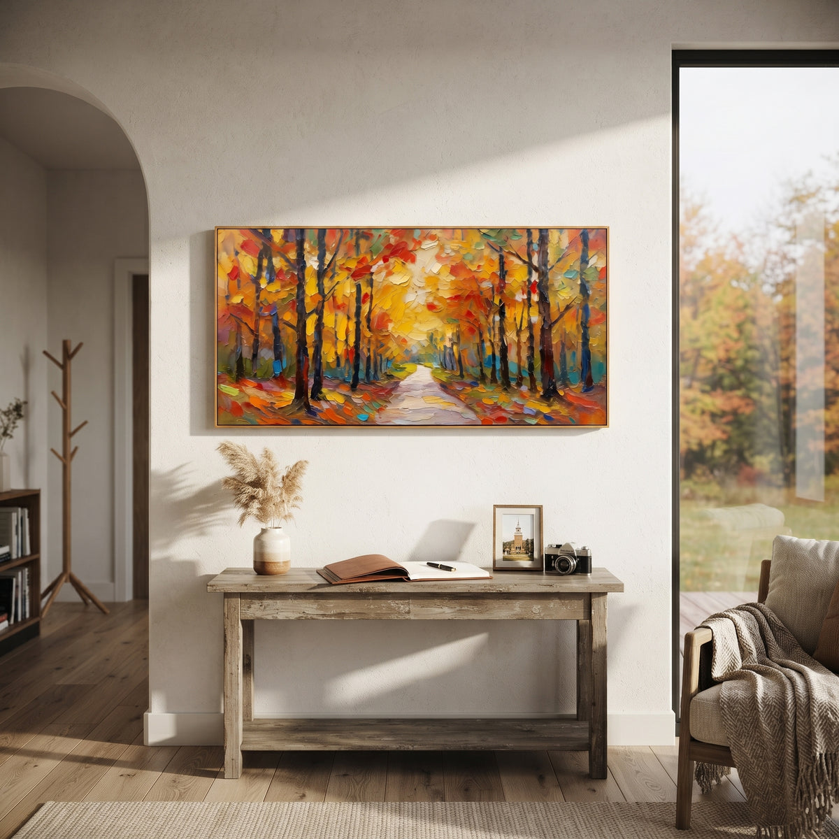 "Golden Autumn Path Painting" focuses on atmosphere, surface movement, and sculptural heavy impasto craftsmanship rather than a fixed literal storyline. The composition uses this hand-painted panoramic canvas presents a warm panoramic woodland path beneath glowing yellow leaves, dark trunks, red accents, and layered impasto brushwork as the visual anchor, while layered palette-knife paint, raised plaster-like texture, and softened brush movement create tactile depth across the canvas. Curated
