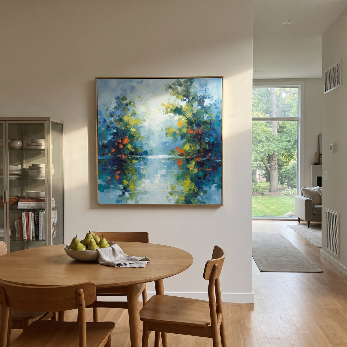 "Blue Green Lake Reflection Painting" focuses on atmosphere, surface movement, and sculptural heavy impasto craftsmanship rather than a fixed literal storyline. The composition uses this hand-painted square canvas presents a calm blue green waterside forest with reflected foliage, pale sky light, orange leaf accents, and layered impasto brushwork as the visual anchor, while layered palette-knife paint, raised plaster-like texture, and softened brush movement create tactile depth across the