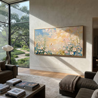 "White Daisy Meadow Painting" focuses on atmosphere, surface movement, and sculptural heavy impasto craftsmanship rather than a fixed literal storyline. The composition uses this hand-painted panoramic canvas presents white daisies and tall meadow stems along a peach and blue sky, with textured petals grouped across the lower panoramic canvas as the visual anchor, while layered palette-knife paint, raised plaster-like texture, and softened brush movement create tactile depth across the canvas.