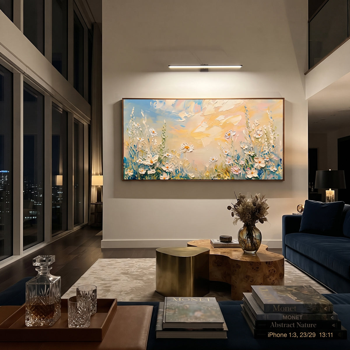 "White Daisy Meadow Painting" focuses on atmosphere, surface movement, and sculptural heavy impasto craftsmanship rather than a fixed literal storyline. The composition uses this hand-painted panoramic canvas presents white daisies and tall meadow stems along a peach and blue sky, with textured petals grouped across the lower panoramic canvas as the visual anchor, while layered palette-knife paint, raised plaster-like texture, and softened brush movement create tactile depth across the canvas.
