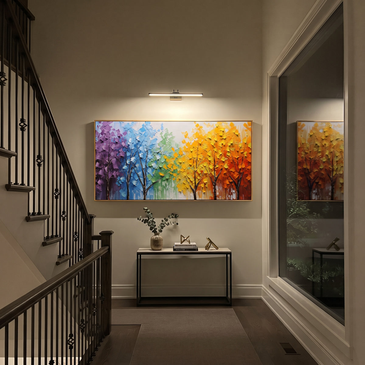 "Rainbow Tree Grove Painting" focuses on atmosphere, surface movement, and sculptural heavy impasto craftsmanship rather than a fixed literal storyline. The composition uses this hand-painted panoramic canvas presents a row of slender dark trees beneath purple, blue, green, yellow, orange, and red foliage, built with thick impasto strokes as the visual anchor, while layered palette-knife paint, raised plaster-like texture, and softened brush movement create tactile depth across the canvas.