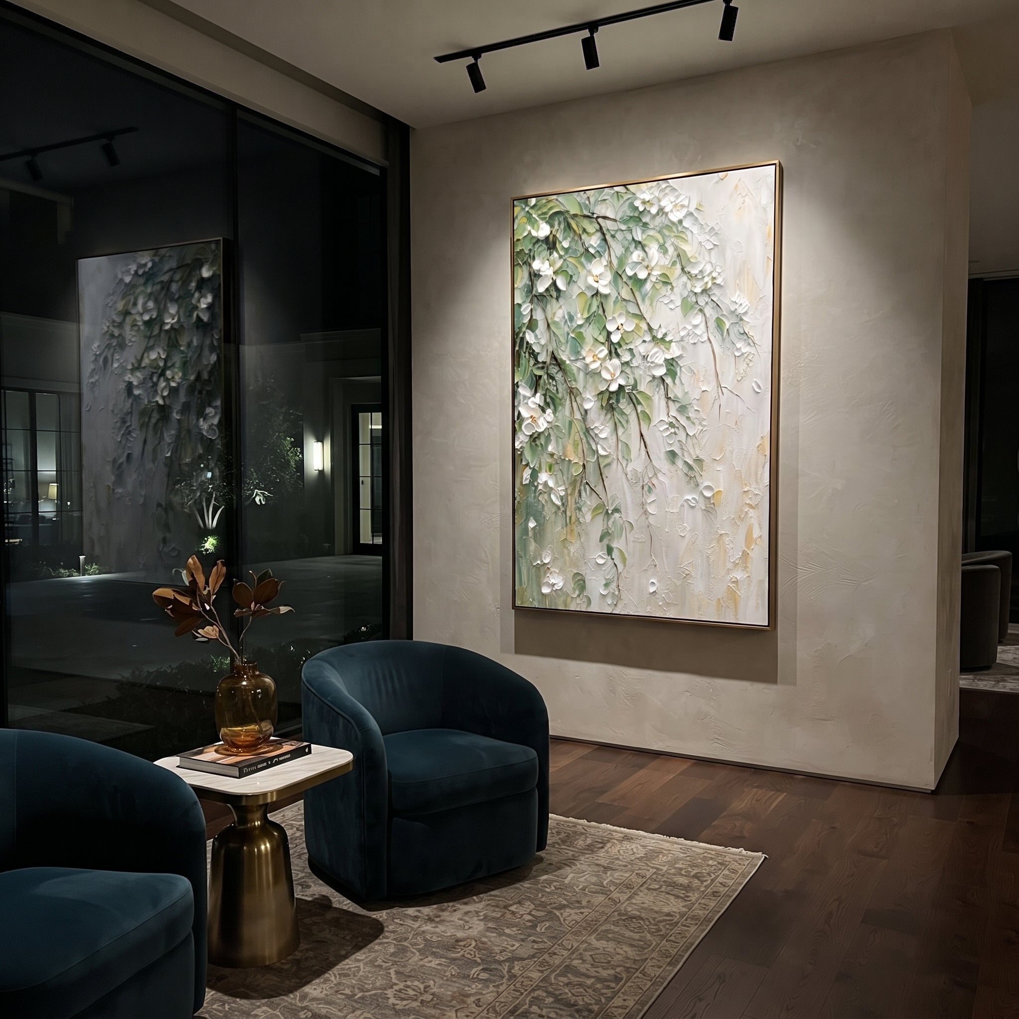 "White Green Floral Branch Painting" focuses on atmosphere, surface movement, and sculptural heavy impasto craftsmanship rather than a fixed literal storyline. The composition uses this hand-painted vertical canvas presents white raised blossoms and green leaves trailing diagonally over a pale textured wall, with thin brown branches and soft gold touches as the visual anchor, while layered palette-knife paint, raised plaster-like texture, and softened brush movement create tactile depth across
