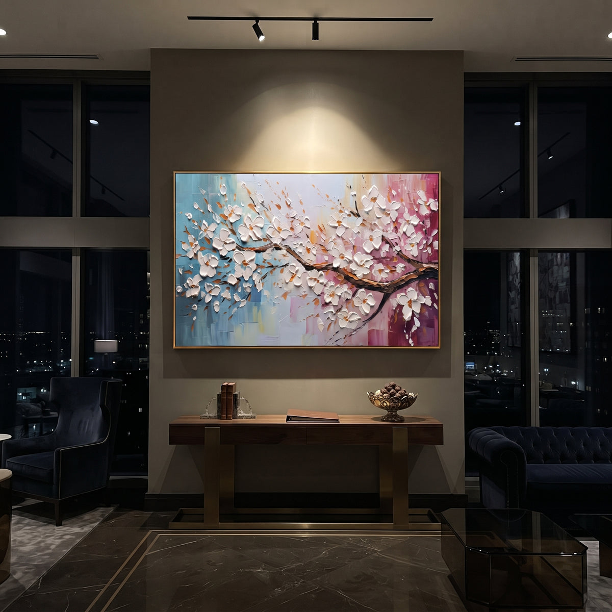 "White Blossom Branch Painting" focuses on atmosphere, surface movement, and sculptural heavy impasto craftsmanship rather than a fixed literal storyline. The composition uses this hand-painted panoramic canvas presents a sweeping branch of raised white blossoms crossing blue, cream, and pink textured background panels with warm brown leaf accents as the visual anchor, while layered palette-knife paint, raised plaster-like texture, and softened brush movement create tactile depth across the