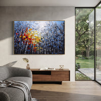 "Blue Birch Autumn Glow Painting" focuses on atmosphere, surface movement, and sculptural heavy impasto craftsmanship rather than a fixed literal storyline. The composition uses this hand-painted horizontal canvas presents blue grey birch woods with white vertical trunks, smoky foliage, and thick red, orange, yellow, and white palette-knife leaves glowing through the center as the visual anchor, while layered palette-knife paint, raised plaster-like texture, and softened brush movement create