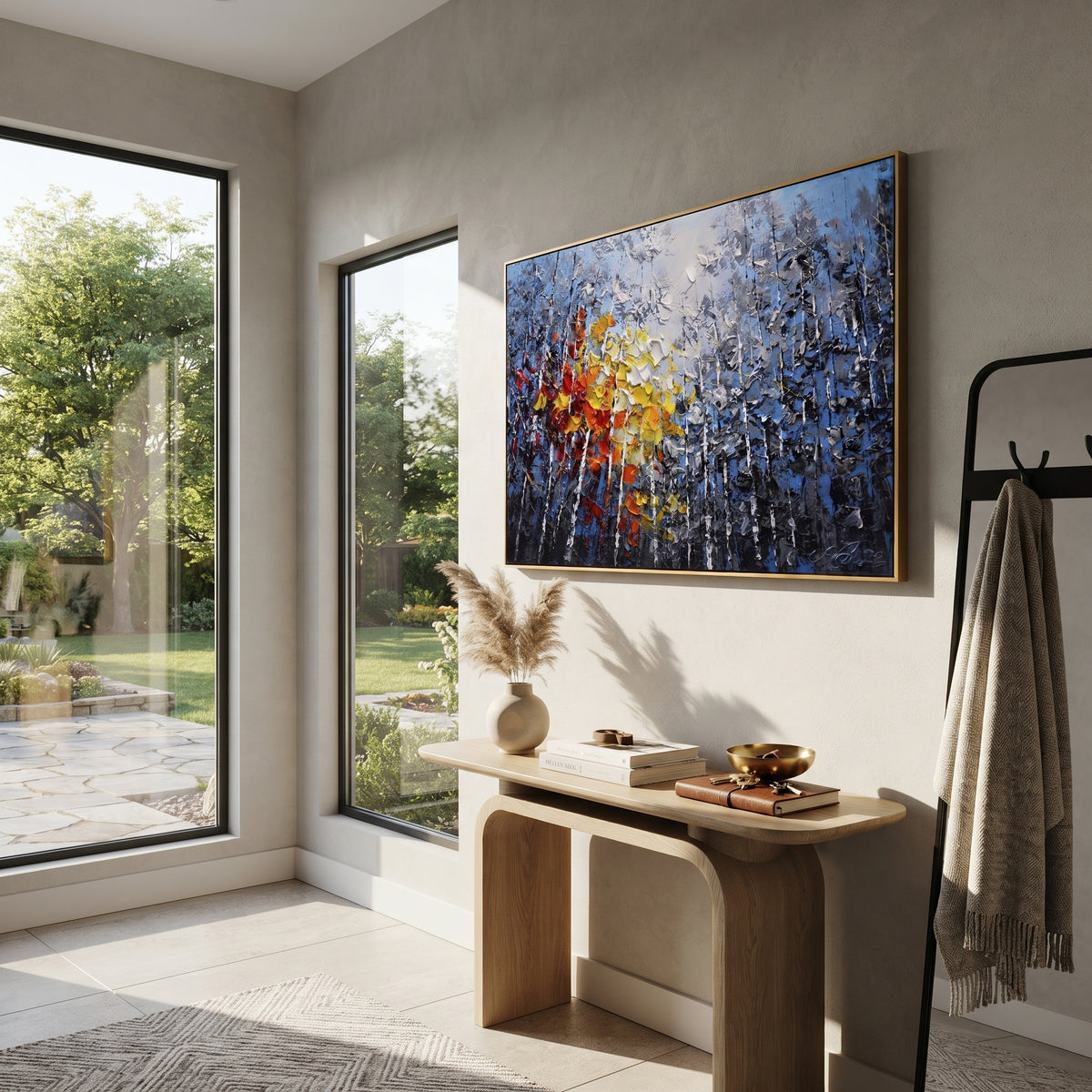 "Blue Birch Autumn Glow Painting" focuses on atmosphere, surface movement, and sculptural heavy impasto craftsmanship rather than a fixed literal storyline. The composition uses this hand-painted horizontal canvas presents blue grey birch woods with white vertical trunks, smoky foliage, and thick red, orange, yellow, and white palette-knife leaves glowing through the center as the visual anchor, while layered palette-knife paint, raised plaster-like texture, and softened brush movement create