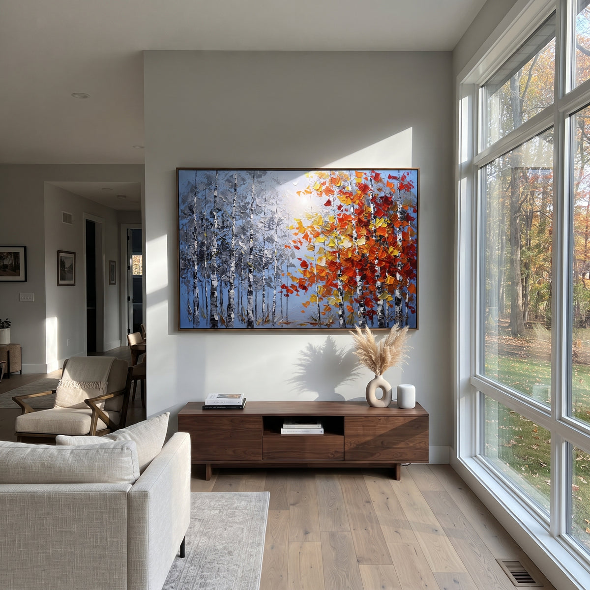 "Silver Birch Red Canopy Painting" focuses on atmosphere, surface movement, and sculptural heavy impasto craftsmanship rather than a fixed literal storyline. The composition uses this hand-painted horizontal canvas contrasts cool silver blue birch trunks on the left with a bright red, orange, and yellow canopy on the right, all built with raised impasto strokes as the visual anchor, while layered palette-knife paint, raised plaster-like texture, and softened brush movement create tactile depth
