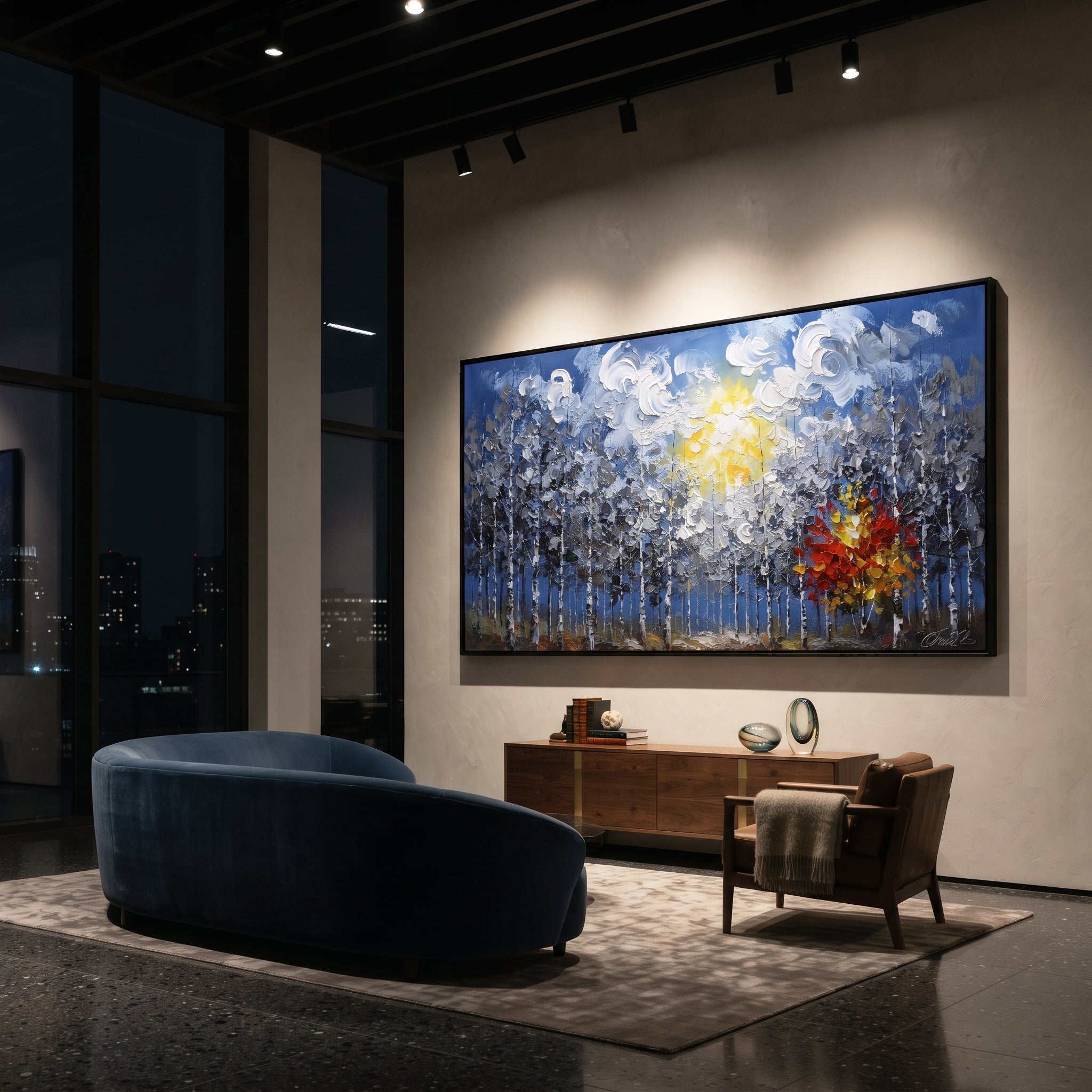 "Blue Forest Sunburst Painting" focuses on atmosphere, surface movement, and sculptural heavy impasto craftsmanship rather than a fixed literal storyline. The composition uses this hand-painted panoramic canvas features a blue birch forest under swirling white clouds and a yellow sun, with one red orange autumn tree glowing against cool grey textured woods as the visual anchor, while layered palette-knife paint, raised plaster-like texture, and softened brush movement create tactile depth across