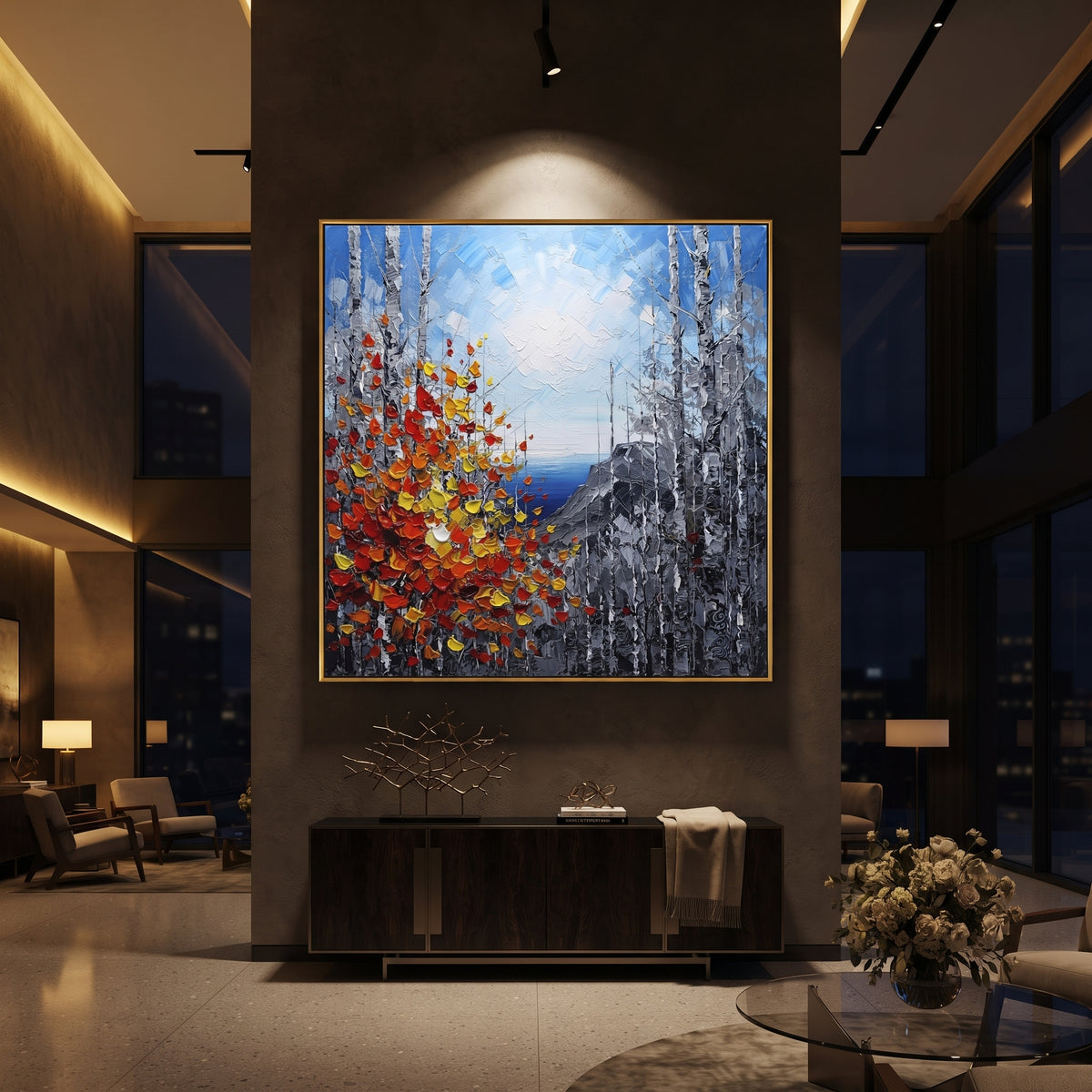 "Cliffside Birch Autumn Painting" focuses on atmosphere, surface movement, and sculptural heavy impasto craftsmanship rather than a fixed literal storyline. The composition uses this hand-painted square canvas looks through birch trunks to a blue water horizon and grey cliffs, with red, orange, and yellow leaves rising in thick strokes from the lower left as the visual anchor, while layered palette-knife paint, raised plaster-like texture, and softened brush movement create tactile depth across