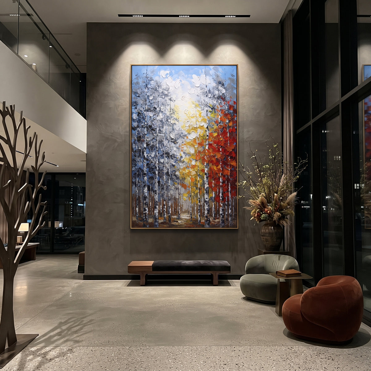 "Golden Path Birch Forest Painting" focuses on atmosphere, surface movement, and sculptural heavy impasto craftsmanship rather than a fixed literal storyline. The composition uses this hand-painted vertical canvas shows a tall birch forest with a bright golden path of yellow and white leaves beside a red orange canopy, set against cool blue grey woods as the visual anchor, while layered palette-knife paint, raised plaster-like texture, and softened brush movement create tactile depth across the