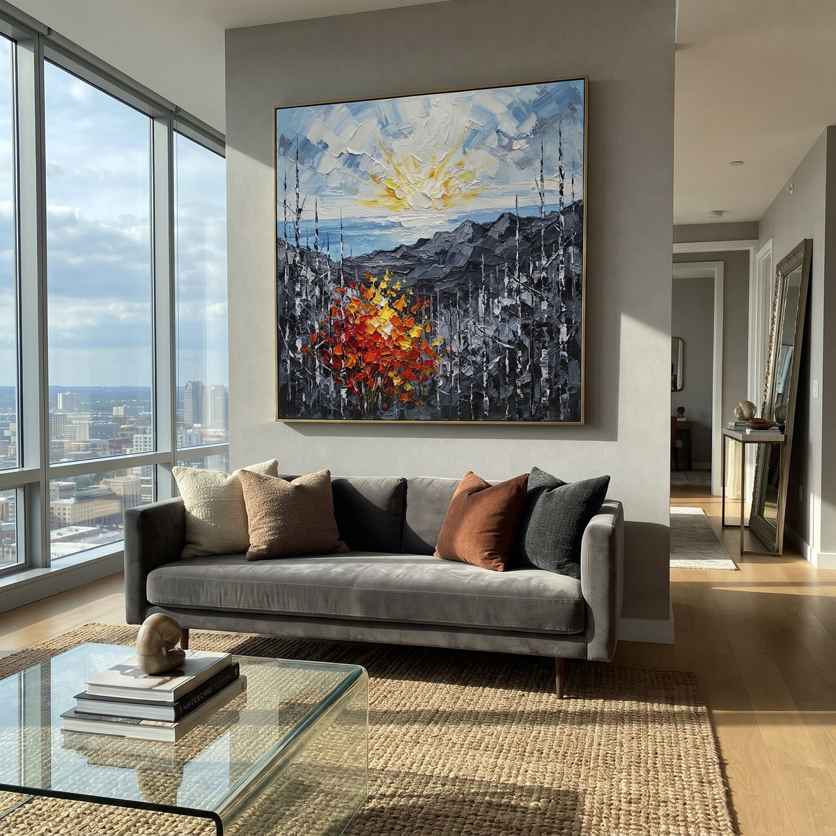 "Sunrise Ridge Birch Painting" focuses on atmosphere, surface movement, and sculptural heavy impasto craftsmanship rather than a fixed literal storyline. The composition uses this hand-painted square canvas presents a glowing sunrise over grey mountain ridges, with black and white birches and a red orange yellow autumn shrub in heavy textured strokes as the visual anchor, while layered palette-knife paint, raised plaster-like texture, and softened brush movement create tactile depth across the
