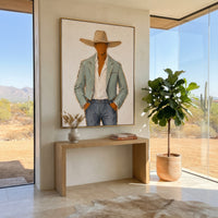 "Close Cowboy Jacket Portrait Painting" focuses on atmosphere, surface movement, and sculptural heavy impasto craftsmanship rather than a fixed literal storyline. The composition uses this hand-painted vertical canvas features a close cropped western figure in a sand colored hat, pale green jacket, white shirt, and blue grey pants as the visual anchor, while layered palette-knife paint, raised plaster-like texture, and softened brush movement create tactile depth across the canvas. Curated with
