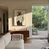 "Back Turn Cowboy Jacket Painting" focuses on atmosphere, surface movement, and sculptural heavy impasto craftsmanship rather than a fixed literal storyline. The composition uses this hand-painted vertical canvas depicts a cowboy from behind, with a pale sage jacket filling the frame beneath a wide beige hat as the visual anchor, while layered palette-knife paint, raised plaster-like texture, and softened brush movement create tactile depth across the canvas. Curated with a balanced green
