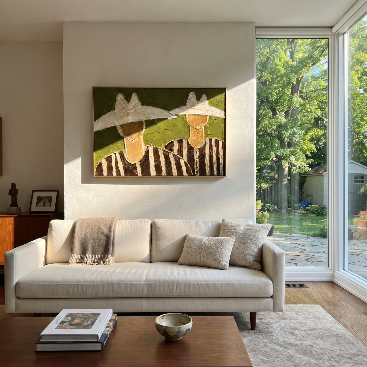 "Two Cowboy Hats Horizontal Painting" focuses on atmosphere, surface movement, and sculptural heavy impasto craftsmanship rather than a fixed literal storyline. The composition uses this hand-painted horizontal canvas shows two cowboy upper bodies under oversized cream hats, set against a muted olive green plaster ground as the visual anchor, while layered palette-knife paint, raised plaster-like texture, and softened brush movement create tactile depth across the canvas. Curated with a balanced