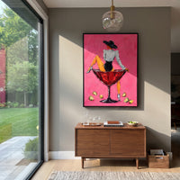 "Back View Martini Cowgirl Painting" focuses on atmosphere, surface movement, and sculptural heavy impasto craftsmanship rather than a fixed literal storyline. The composition uses this hand-painted vertical canvas shows a cowgirl turned away while sitting on a red martini glass against a hot pink textured background as the visual anchor, while layered palette-knife paint, raised plaster-like texture, and softened brush movement create tactile depth across the canvas. Curated with a balanced