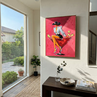 "Relaxed Martini Cowgirl Painting" focuses on atmosphere, surface movement, and sculptural heavy impasto craftsmanship rather than a fixed literal storyline. The composition uses this hand-painted vertical canvas features a relaxed cowgirl leaning across a red cocktail glass with one arm behind her head as the visual anchor, while layered palette-knife paint, raised plaster-like texture, and softened brush movement create tactile depth across the canvas. Curated with a balanced pink, orange
