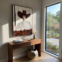 "Round Brown Hat Portrait Painting" focuses on atmosphere, surface movement, and sculptural heavy impasto craftsmanship rather than a fixed literal storyline. The composition uses this hand-painted vertical canvas shows a faceless western figure wearing a large rounded brown hat and a white shirt with narrow black stripes as the visual anchor, while layered palette-knife paint, raised plaster-like texture, and softened brush movement create tactile depth across the canvas. Curated with a