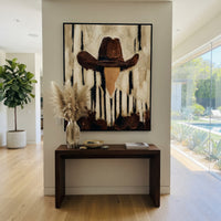 "Vertical Stripe Brown Hat Portrait Painting" focuses on atmosphere, surface movement, and sculptural heavy impasto craftsmanship rather than a fixed literal storyline. The composition uses this hand-painted vertical canvas shows a faceless western portrait under a broad brown hat, with black vertical marks falling through the cream striped shirt and background as the visual anchor, while layered palette-knife paint, raised plaster-like texture, and softened brush movement create tactile depth