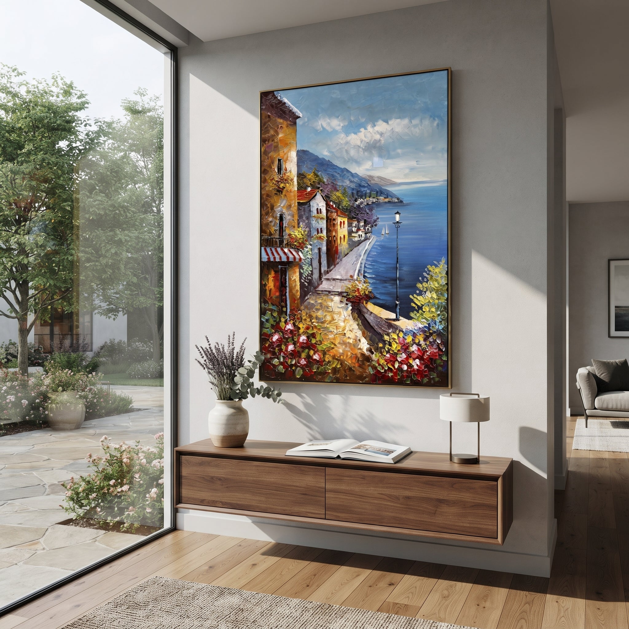 "Cliffside Coastal Vista PT 1572" focuses on atmosphere, surface movement, and sculptural heavy impasto craftsmanship rather than a fixed literal storyline. The composition uses this hand-painted Mediterranean canvas features steep coastal cliffs, hillside village, deep blue water, floral foreground, textured sky, built with raised palette-knife texture, layered brushwork, and luminous coastal color as the visual anchor, while layered palette-knife paint, raised plaster-like texture, and