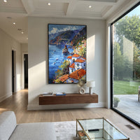 "Bougainvillea Sea Lane PT 1576" focuses on atmosphere, surface movement, and sculptural heavy impasto craftsmanship rather than a fixed literal storyline. The composition uses this hand-painted Mediterranean canvas features whitewashed stone lane, cascading pink bougainvillea, blue sea opening, sunlit village walls, built with raised palette-knife texture, layered brushwork, and luminous coastal color as the visual anchor, while layered palette-knife paint, raised plaster-like texture, and