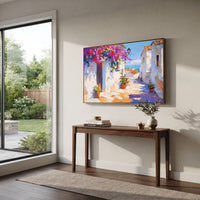 "Seaside Terrace Sailboats Painting" focuses on atmosphere, surface movement, and sculptural heavy impasto craftsmanship rather than a fixed literal storyline. The composition uses this hand-painted Mediterranean canvas features sailboats on a blue bay, flowering terrace, coastal town and luminous summer sky, built with raised palette-knife texture, layered brushwork, and luminous coastal color as the visual anchor, while layered palette-knife paint, raised plaster-like texture, and softened
