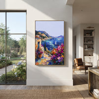"Seaside Flower Lane Painting" focuses on atmosphere, surface movement, and sculptural heavy impasto craftsmanship rather than a fixed literal storyline. The composition uses this hand-painted Mediterranean canvas features whitewashed stone lane, cascading pink bougainvillea, blue sea opening, sunlit village walls, built with raised palette-knife texture, layered brushwork, and luminous coastal color as the visual anchor, while layered palette-knife paint, raised plaster-like texture, and