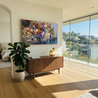 "Pastel Houses Cliff Painting" focuses on atmosphere, surface movement, and sculptural heavy impasto craftsmanship rather than a fixed literal storyline. The composition uses this hand-painted Mediterranean canvas features stacked pastel buildings on seaside cliffs, boats below, bright impasto coastal color, built with raised palette-knife texture, layered brushwork, and luminous coastal color as the visual anchor, while layered palette-knife paint, raised plaster-like texture, and softened
