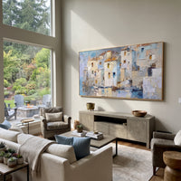 "Mediterranean Patio Painting" focuses on atmosphere, surface movement, and sculptural heavy impasto craftsmanship rather than a fixed literal storyline. The composition uses this hand-painted Mediterranean canvas features white stucco terrace, blue doors, potted blooms, open view toward the Mediterranean, built with raised palette-knife texture, layered brushwork, and luminous coastal color as the visual anchor, while layered palette-knife paint, raised plaster-like texture, and softened brush