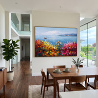 "Sailing Coast Garden Coastal Painting" focuses on atmosphere, surface movement, and sculptural heavy impasto craftsmanship rather than a fixed literal storyline. The composition uses this hand-painted Mediterranean canvas features sailboats on a blue bay, flowering terrace, coastal town and luminous summer sky, built with raised palette-knife texture, layered brushwork, and luminous coastal color as the visual anchor, while layered palette-knife paint, raised plaster-like texture, and softened