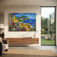 "Sailing Coast Garden Coastal with Sailboats Painting" focuses on atmosphere, surface movement, and sculptural heavy impasto craftsmanship rather than a fixed literal storyline. The composition uses this hand-painted Mediterranean canvas features sailboats on a blue bay, flowering terrace, coastal town and luminous summer sky, built with raised palette-knife texture, layered brushwork, and luminous coastal color as the visual anchor, while layered palette-knife paint, raised plaster-like