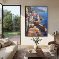"Terracotta Village Lane Painting" focuses on atmosphere, surface movement, and sculptural heavy impasto craftsmanship rather than a fixed literal storyline. The composition uses this hand-painted Mediterranean canvas features white Mediterranean alley, terracotta roofs, potted flowers, distant sea and mountain light, built with raised palette-knife texture, layered brushwork, and luminous coastal color as the visual anchor, while layered palette-knife paint, raised plaster-like texture, and
