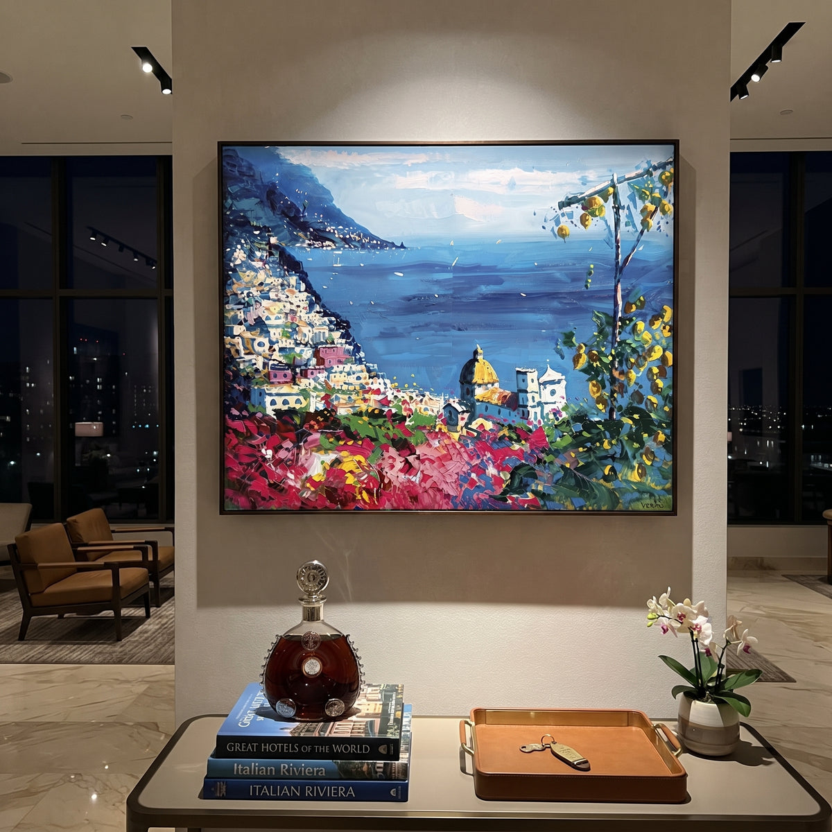 "Cliffside Coastal Vista Coastal with Sailboats Painting" focuses on atmosphere, surface movement, and sculptural heavy impasto craftsmanship rather than a fixed literal storyline. The composition uses this hand-painted Mediterranean canvas features steep coastal cliffs, hillside village, deep blue water, floral foreground, textured sky, built with raised palette-knife texture, layered brushwork, and luminous coastal color as the visual anchor, while layered palette-knife paint, raised