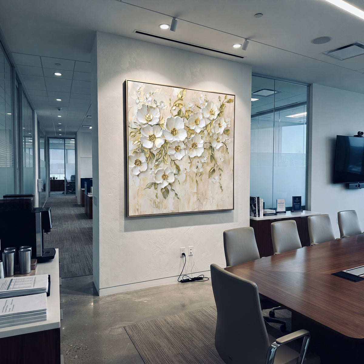 This white botanical blossom relief painting combines raised white flowers, fine green leaf stems, and muted gold centers over a lightly textured ivory ground. The square layout creates a graceful floral wall feature with soft handmade dimension.