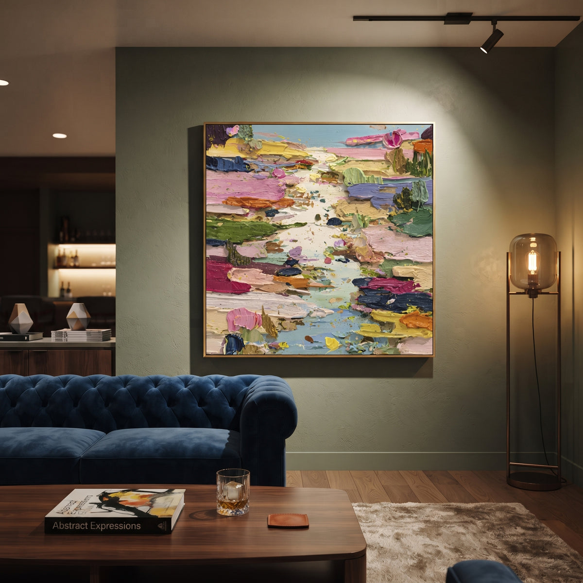 Colorful Lily Pond Impasto focuses on this hand-painted square textured canvas presents a colorful lily pond abstraction with pink blossoms, green pads, blue water, yellow and orange accents, and thick expressive impasto texture. The composition is described from the actual main image, so the visible subject, color balance, spacing, and surface movement stay specific to this product instead of reading like a batch title. Raised palette-knife layers, sculpted impasto ridges, softened brush
