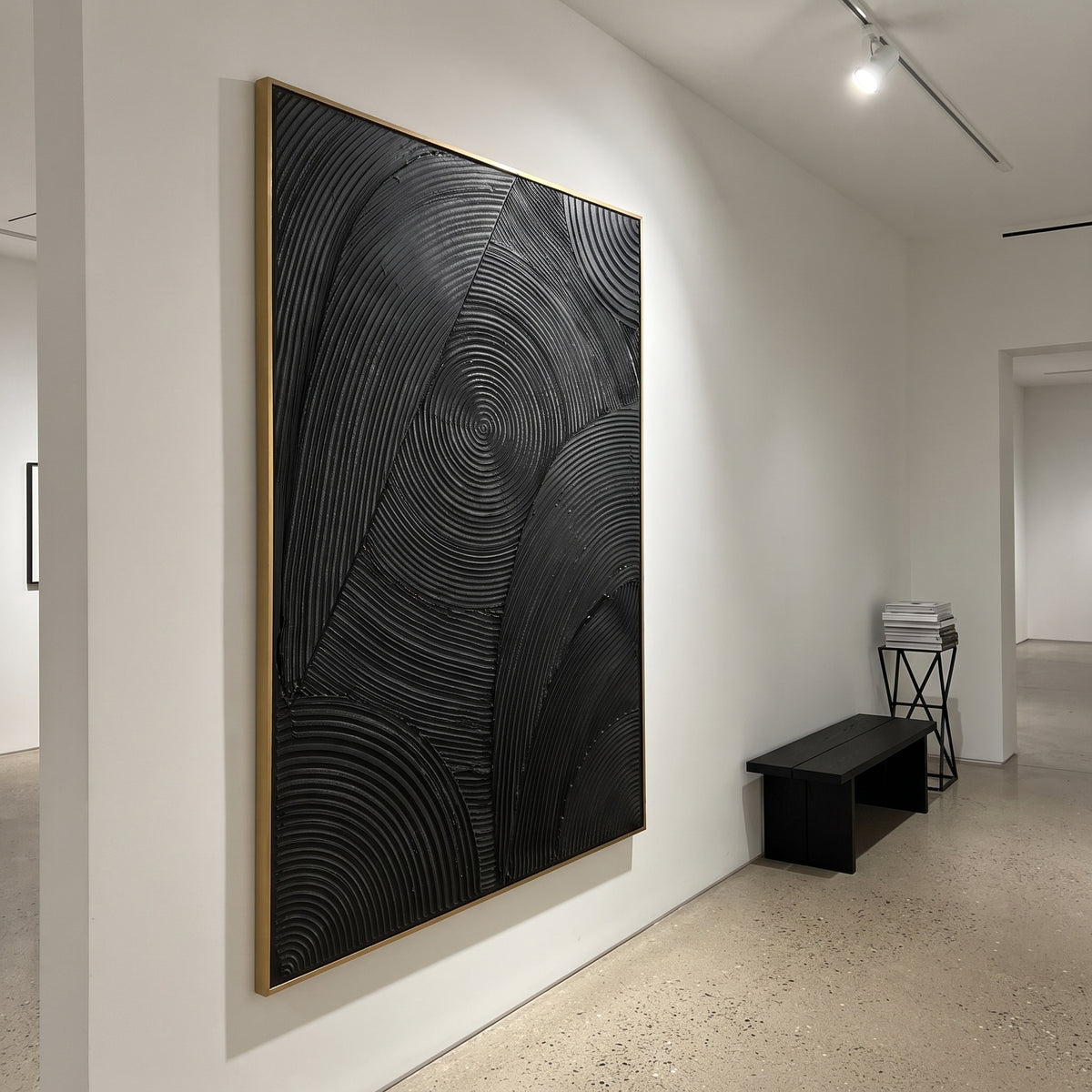 Black Concentric Line Relief focuses on this hand-painted vertical textured canvas features a monochrome black surface with carved concentric arcs, geometric panels, and raised linear relief that creates a refined modern pattern. The composition is described from the actual main image, so the visible subject, color balance, spacing, and surface movement stay specific to this product instead of reading like a batch title. Raised palette-knife layers, sculpted impasto ridges, softened brush