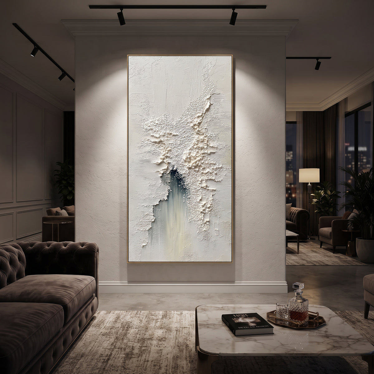 White Fragmented Plaster Relief focuses on this hand-painted vertical textured canvas features a mostly white fragmented plaster surface with raised cracked texture, fine scraped marks, and a muted blue-grey vertical accent. The composition is described from the actual main image, so the visible subject, color balance, spacing, and surface movement stay specific to this product instead of reading like a batch title. Raised palette-knife layers, sculpted impasto ridges, softened brush