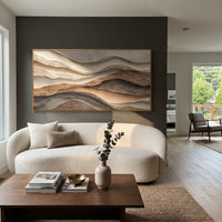 Warm Layered Terrain Relief focuses on this hand-painted panoramic textured canvas presents warm orange-brown, black, beige, and ivory plaster layers with carved terrain-like movement and raised abstract depth. The composition is described from the actual main image, so the visible subject, color balance, spacing, and surface movement stay specific to this product instead of reading like a batch title. Raised palette-knife layers, sculpted impasto ridges, softened brush transitions, and tactile
