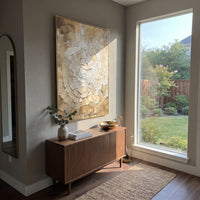Golden Radial Shell Relief focuses on this hand-painted textured canvas features a fan-like radial shell pattern, carved ribbed plaster marks, warm gold shading, and layered white beige relief texture. The composition is described from the actual main image, so the visible subject, color balance, spacing, and surface movement stay specific to this product instead of reading like a batch title. Raised palette-knife layers, sculpted impasto ridges, softened brush transitions, and tactile handmade