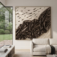Black Draped Plaster Relief focuses on this hand-painted textured canvas features a dramatic black folded drapery form across a white plaster ground, scattered dark cutout marks, and sculptural fabric-like relief. The composition is described from the actual main image, so the visible subject, color balance, spacing, and surface movement stay specific to this product instead of reading like a batch title. Raised palette-knife layers, sculpted impasto ridges, softened brush transitions, and
