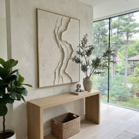 White S Curve Relief focuses on this hand-painted textured canvas features a vertical white S-curve ridge with layered plaster contours over a quiet textured neutral ground. The composition is described from the actual main image, so the visible subject, color balance, spacing, and surface movement stay specific to this product instead of reading like a batch title. Raised palette-knife layers, sculpted impasto ridges, softened brush transitions, and tactile handmade texture give the canvas
