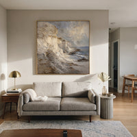 Neutral Cliff Coast Impasto focuses on this hand-painted textured canvas features a neutral cliffside coast with heavy impasto rock faces, soft grey sky, and small blue water accents. The composition is described from the actual main image, so the visible subject, color balance, spacing, and surface movement stay specific to this product instead of reading like a batch title. Raised palette-knife layers, sculpted impasto ridges, softened brush transitions, and tactile handmade texture give the