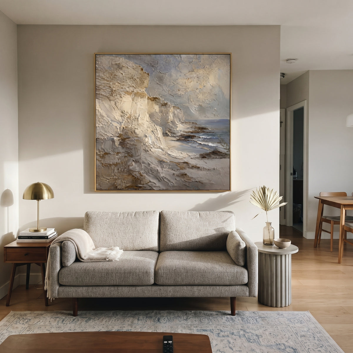 Neutral Cliff Coast Impasto focuses on this hand-painted textured canvas features a neutral cliffside coast with heavy impasto rock faces, soft grey sky, and small blue water accents. The composition is described from the actual main image, so the visible subject, color balance, spacing, and surface movement stay specific to this product instead of reading like a batch title. Raised palette-knife layers, sculpted impasto ridges, softened brush transitions, and tactile handmade texture give the
