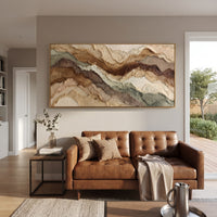 Earth Tone Mountain Layers focuses on this hand-painted textured canvas features wide layered earth-tone mountain bands with raised edges, sage accents, and warm mineral texture. The composition is described from the actual main image, so the visible subject, color balance, spacing, and surface movement stay specific to this product instead of reading like a batch title. Raised palette-knife layers, sculpted impasto ridges, softened brush transitions, and tactile handmade texture give the canvas