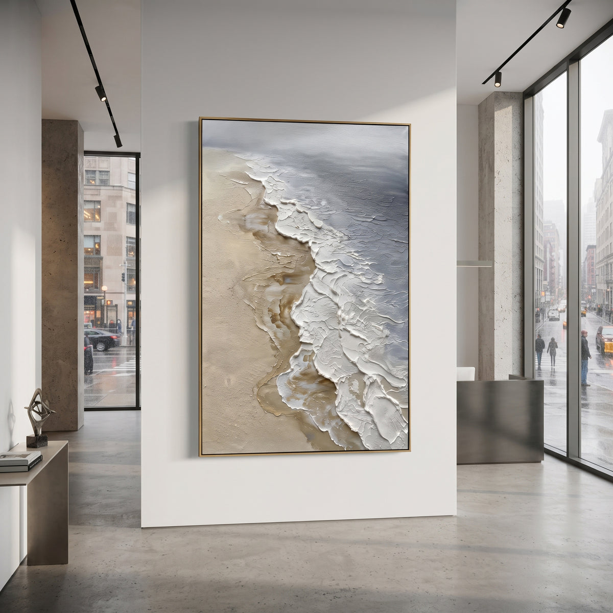 Neutral Foamy Shoreline Relief focuses on this hand-painted textured canvas features a vertical aerial shore with sandy beige texture, raised white foam edges, and grey water tones. The title and description are matched to the actual main image, so the visible subject, color balance, spacing, and surface movement stay specific to this product instead of using a repeated batch phrase. Raised palette-knife layers, sculpted impasto ridges, softened brush transitions, and tactile handmade texture