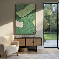 Cream Path Golfers Relief focuses on this hand-painted textured canvas features cream fairway path crossing green terrain, small golfers, and raised rectangular turf textures. The composition is described from the actual main image, so the visible subject, color balance, spacing, and surface movement stay specific to this product instead of reading like a batch title. Raised palette-knife layers, sculpted impasto ridges, softened brush transitions, and tactile handmade texture give the canvas
