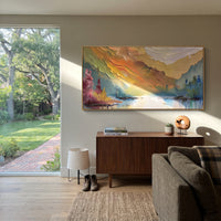 Rainbow Mountain Lake focuses on this hand-painted textured canvas features rainbow-toned mountain lake with orange ridges, green banks, and soft reflected water. The composition is described from the actual main image, so the visible subject, color balance, spacing, and surface movement stay specific to this product instead of reading like a batch title. Raised palette-knife layers, sculpted impasto ridges, softened brush transitions, and tactile handmade texture give the canvas dimensional