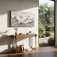 White Alpine Ridge Relief focuses on this hand-painted textured canvas features White Alpine Ridge Relief with sculpted snowy mountain folds and grey valleys. The composition is described from the actual main image, so the visible subject, color balance, spacing, and surface movement stay specific to this product instead of reading like a batch title. Raised palette-knife layers, sculpted impasto ridges, softened brush transitions, and tactile handmade texture give the canvas dimensional depth