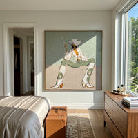 Seated Cowboy Sage Figure focuses on a seated cowboy figure in a wide white hat against muted sage and beige blocks, using the sage green family as the main atmosphere while keeping the subject and composition specific to the actual main image. The visible details are described from the artwork itself: the placement of the main forms, the surrounding negative space, the relationship between pale highlights and deeper green or dark accents, and the direction of the brushwork across the surface.